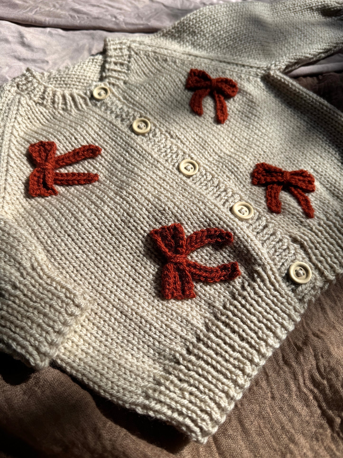 Knitted to order bow personalised cardigan/jumper