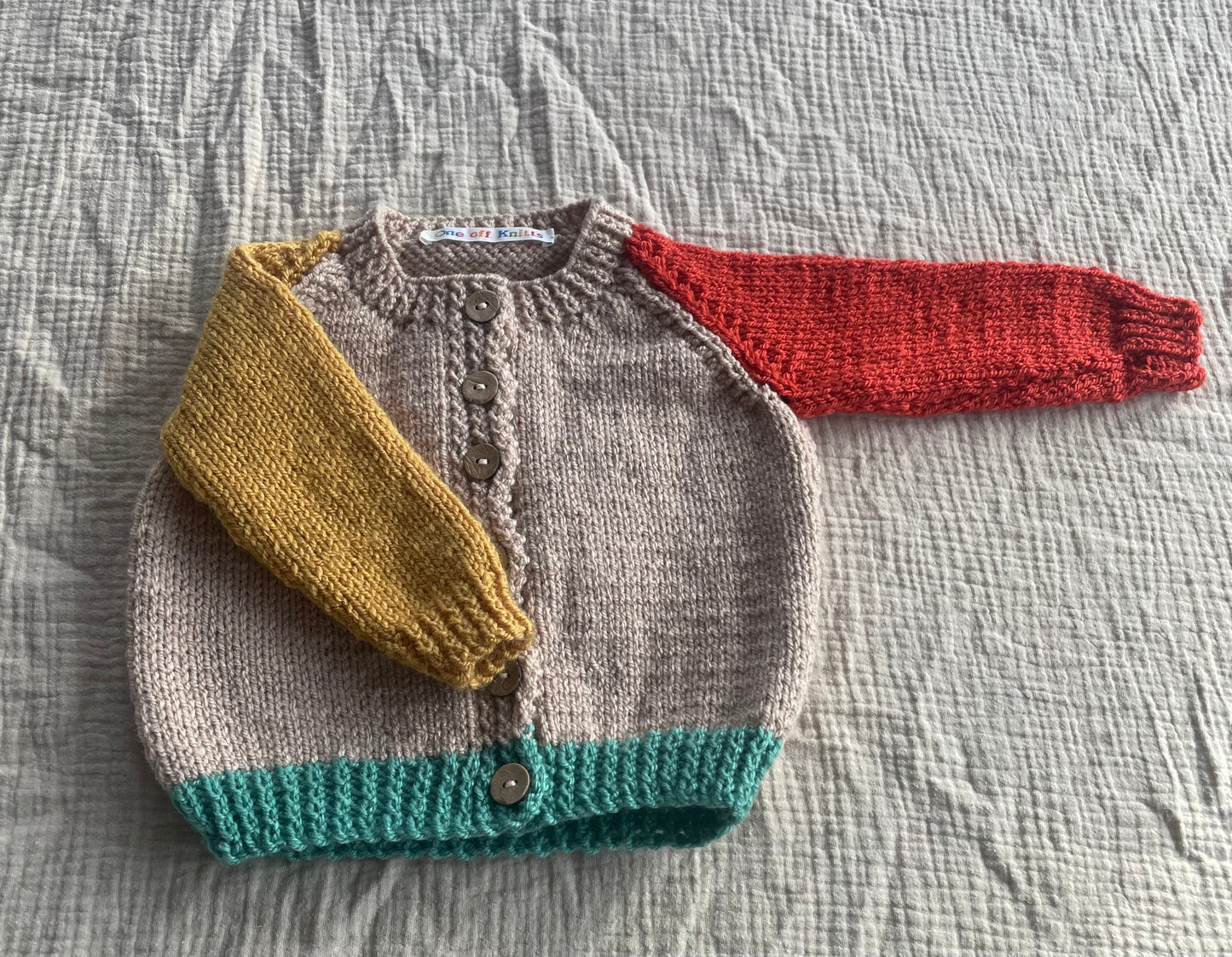 6-9 months beige cardigan with multi colour sleeves