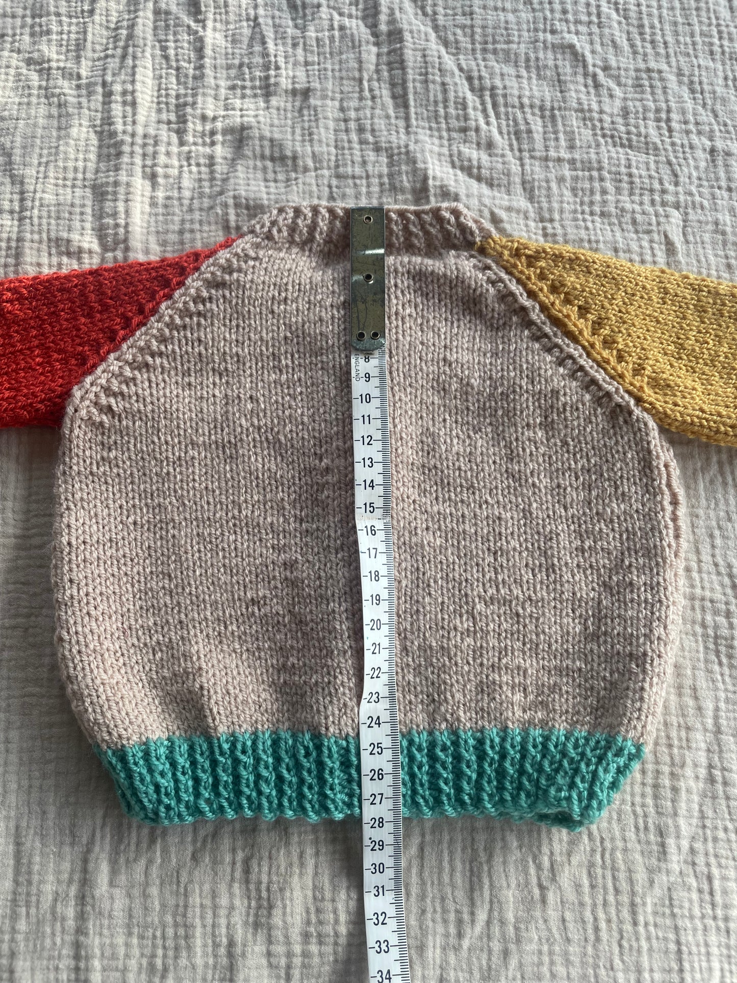 6-9 months beige cardigan with multi colour sleeves