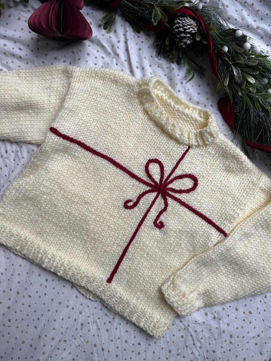 Preloved Super chunky adults size 14-16 warm cream with red present