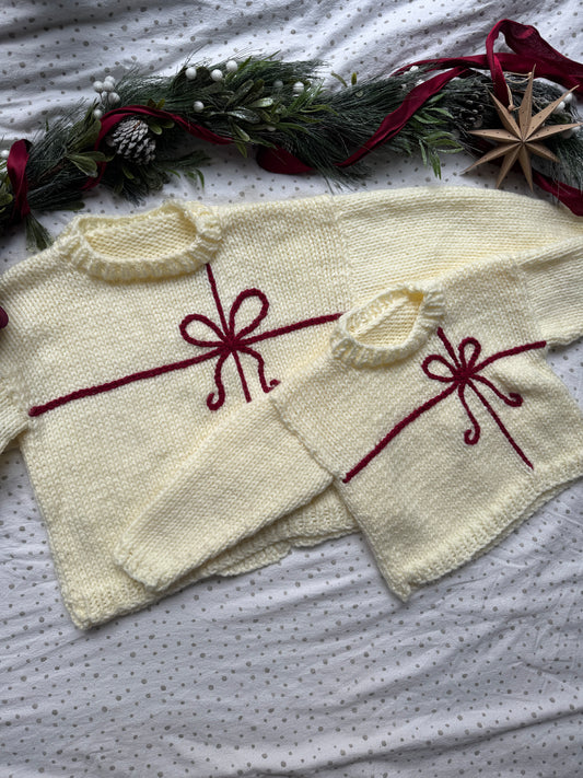 Preloved Super chunky adults size 14-16 warm cream with red present