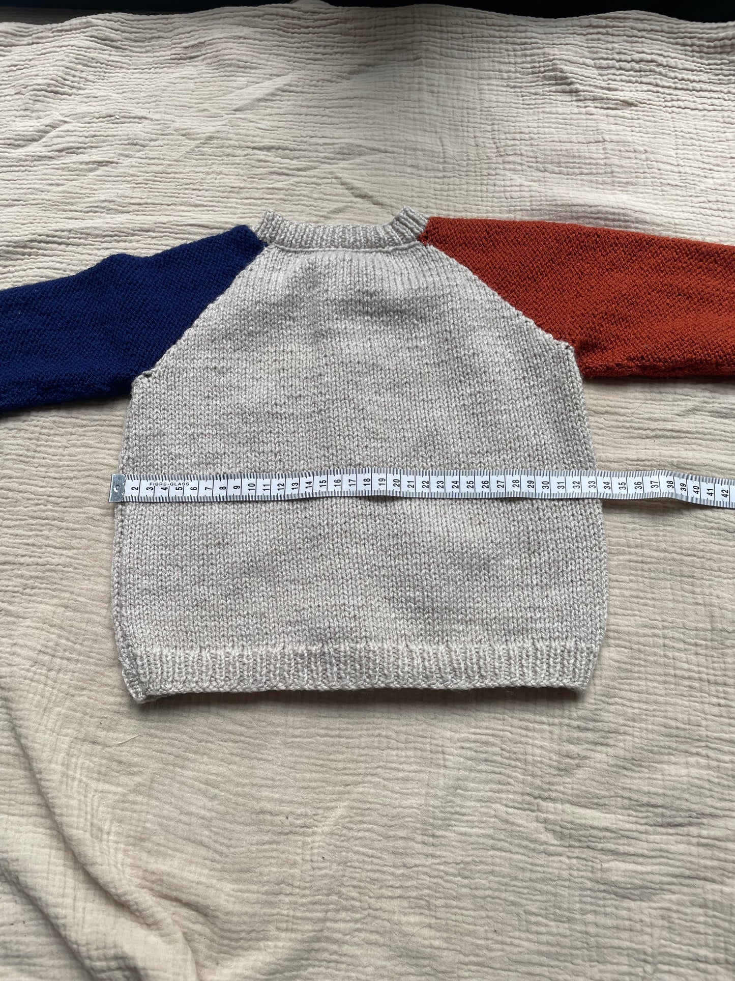 1-2 years parchment cardigan with blue and orange sleeves